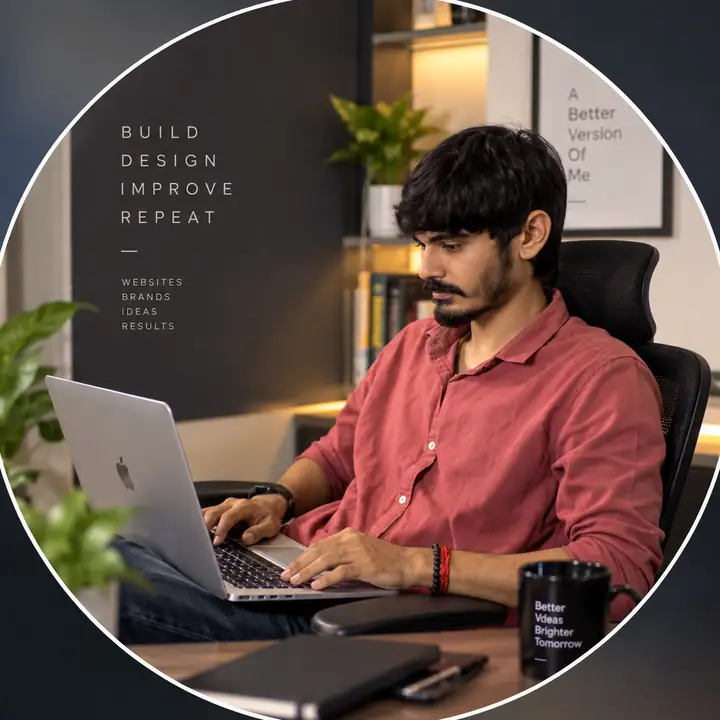Aniruddh Lakhnotra working on a laptop at his desk